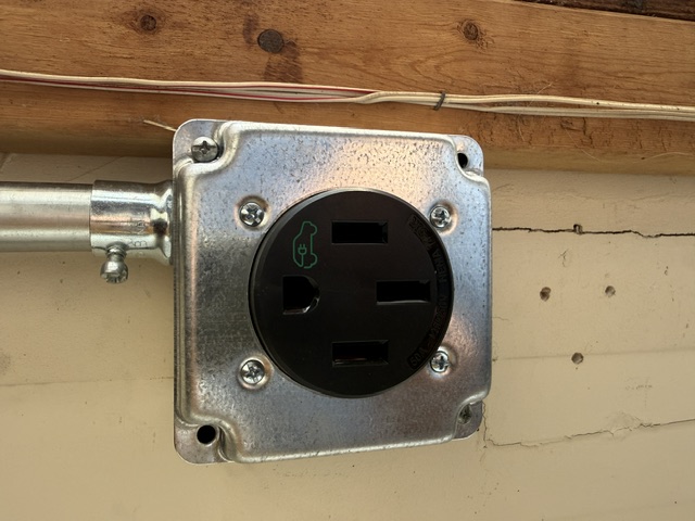 Dedicated electrical outlet mounted in a metal enclosure