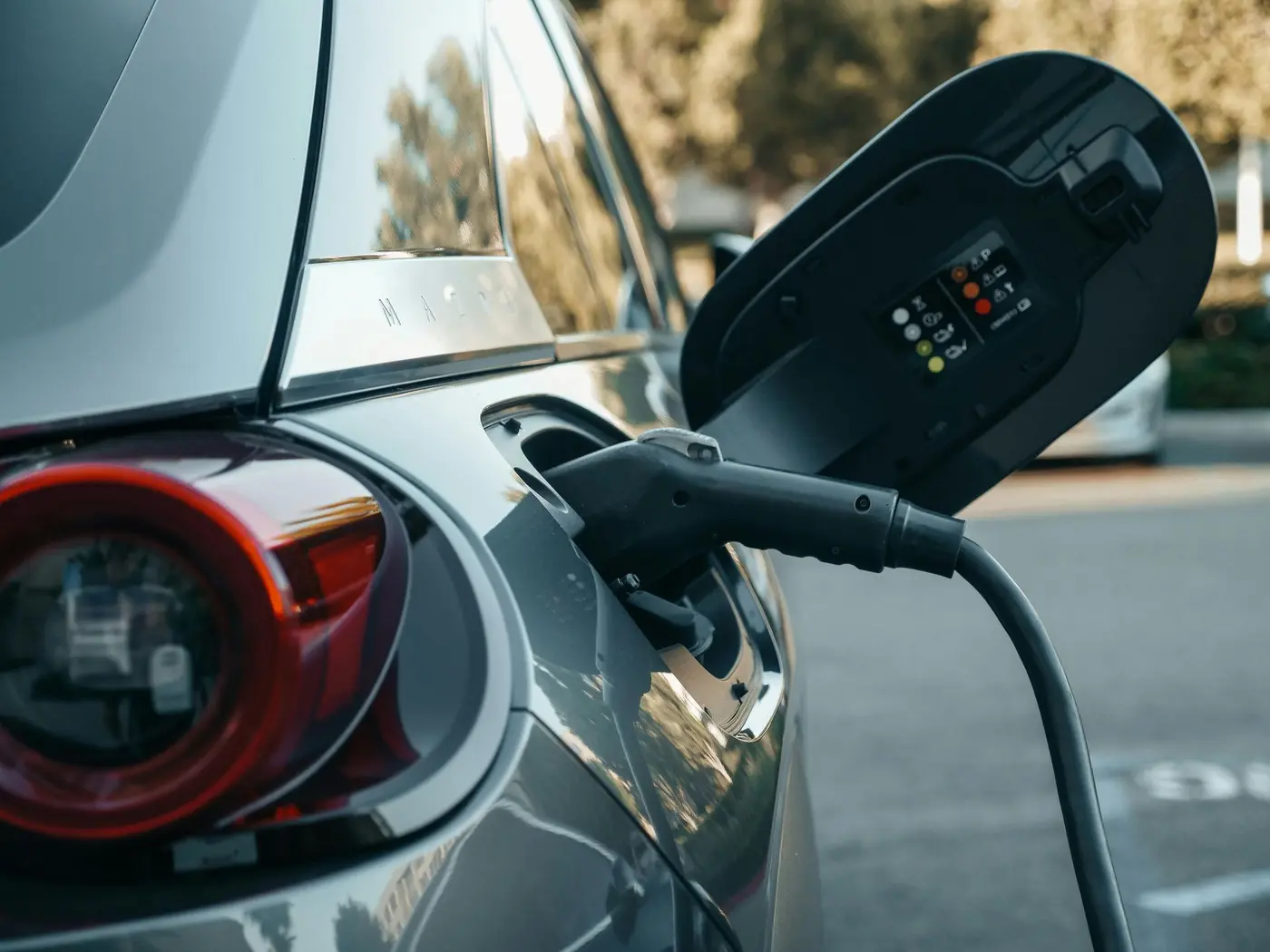 Electric car connected to a charging cable