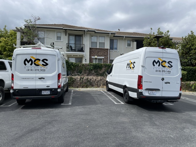 Two MCS Electric service vans parked together