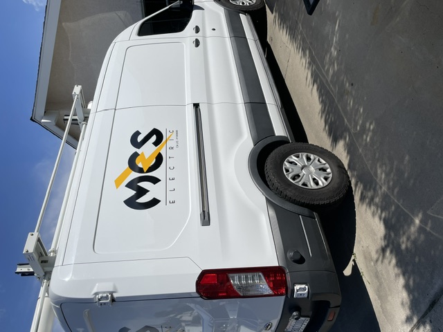 MCS Electric logo and equipment rack on a service van