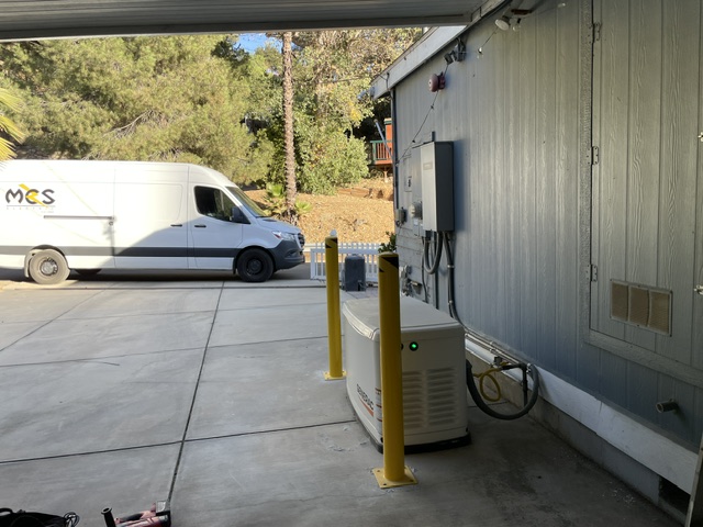 MCS Electric service van beside an electrical equipment enclosure