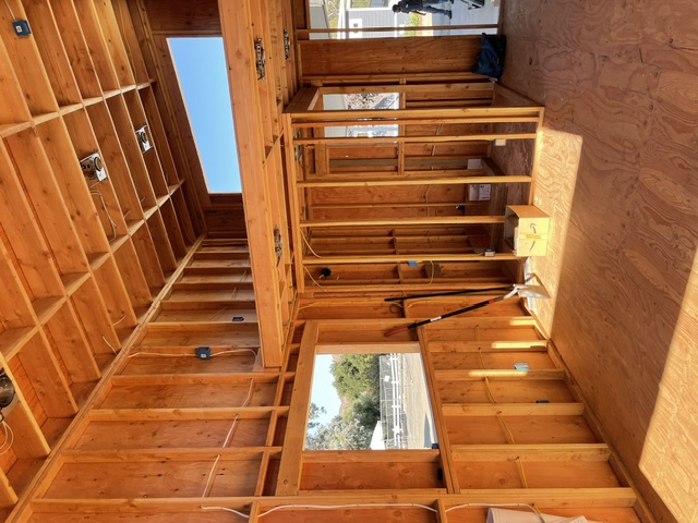 Electrical rough-in within exposed framing on a new construction project