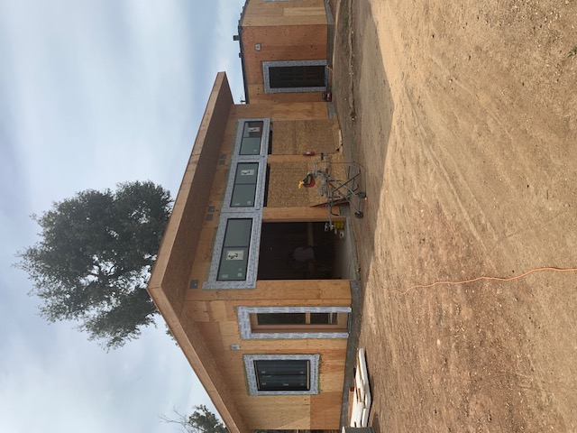 Exterior view of a new residential building during construction