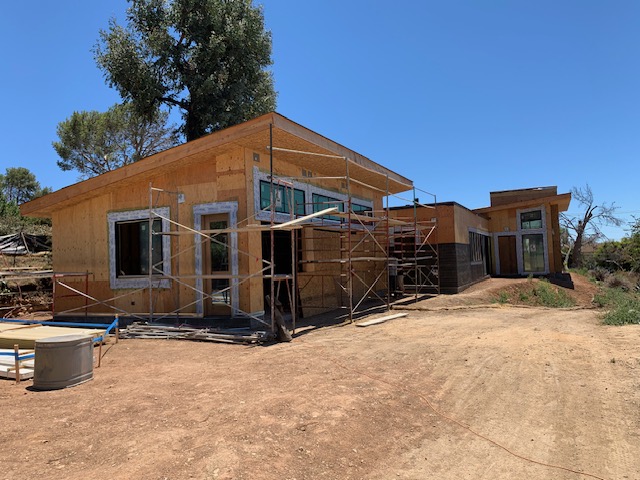 Exterior framing and roof work on a residential construction project
