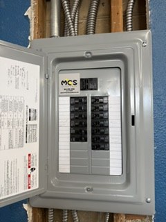 MCS Electric panel upgrade with labeled breakers and company sticker