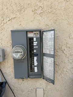 Exterior electrical meter and breaker panel