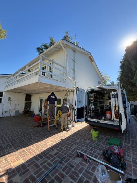 MCS Electric crew and service van at a residential electrical project